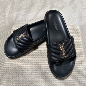 Yves Saint Laurent Black Slides with Gold Emblem